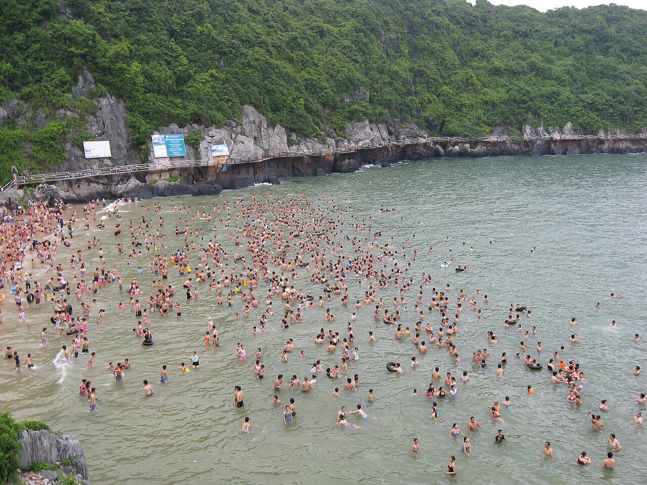 Visitors swimming at a Cat Ba beach
