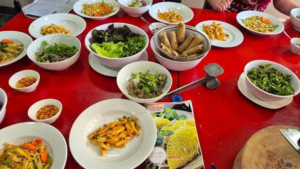 A shared table of Vietnamese dishes