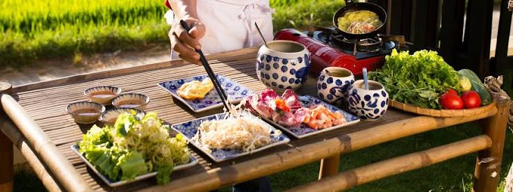 A cook preparing a meal with fresh ingredients