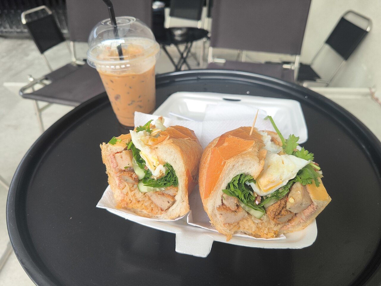 Bánh mì and iced Vietnamese coffee, photographed in Saigon