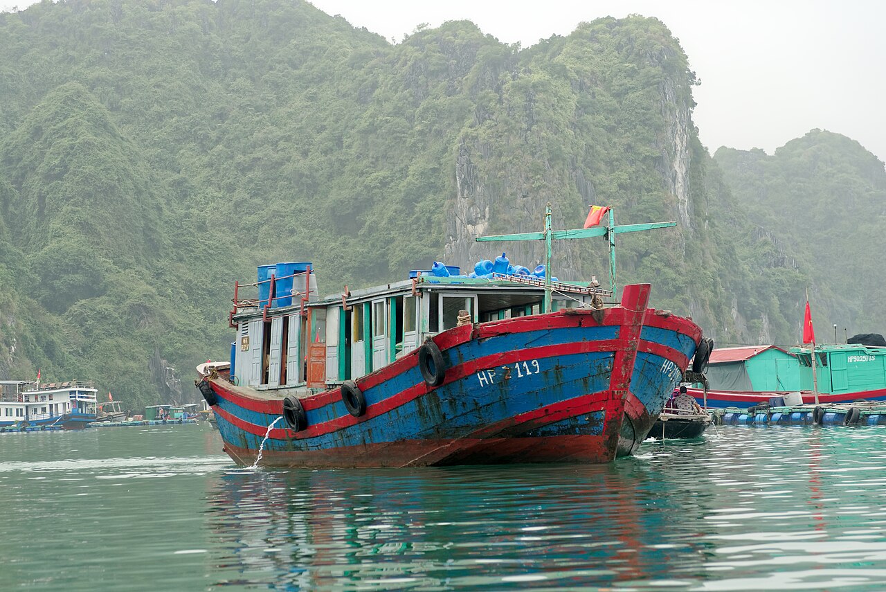 Large wooden workboat near Cai Beo floating structures