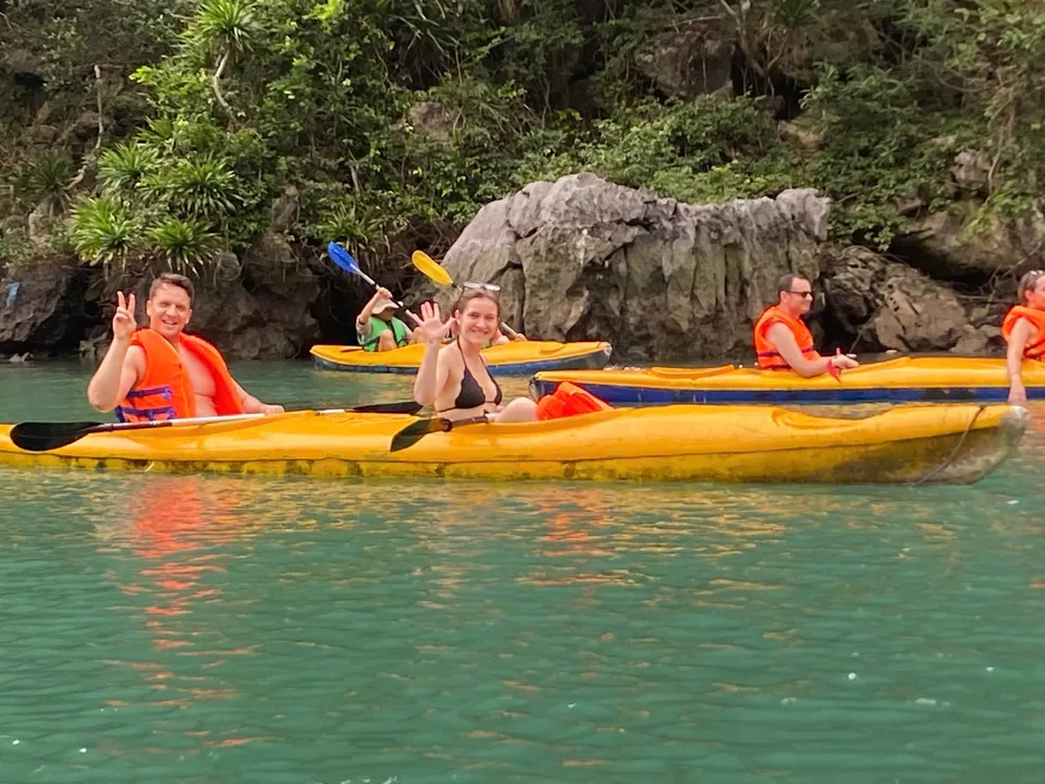 Kayaking beside the forested cliffs