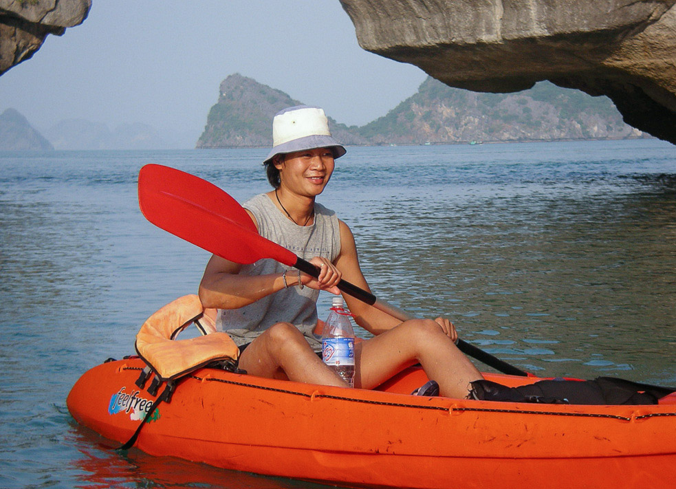 Local kayaking guide in a kayak off Cat Ba