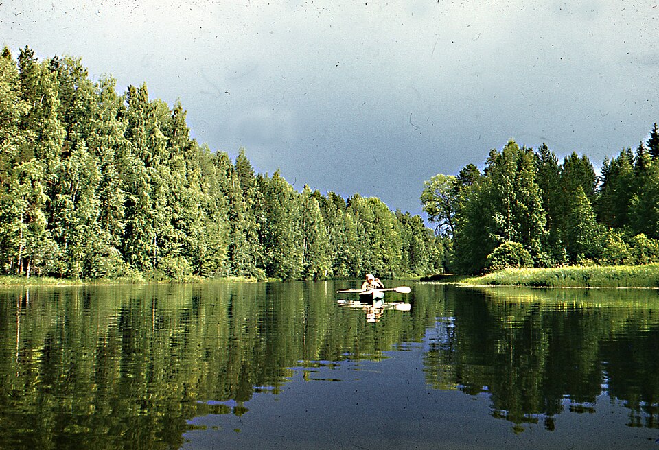 Paddlers beneath approaching rain clouds outside Vietnam