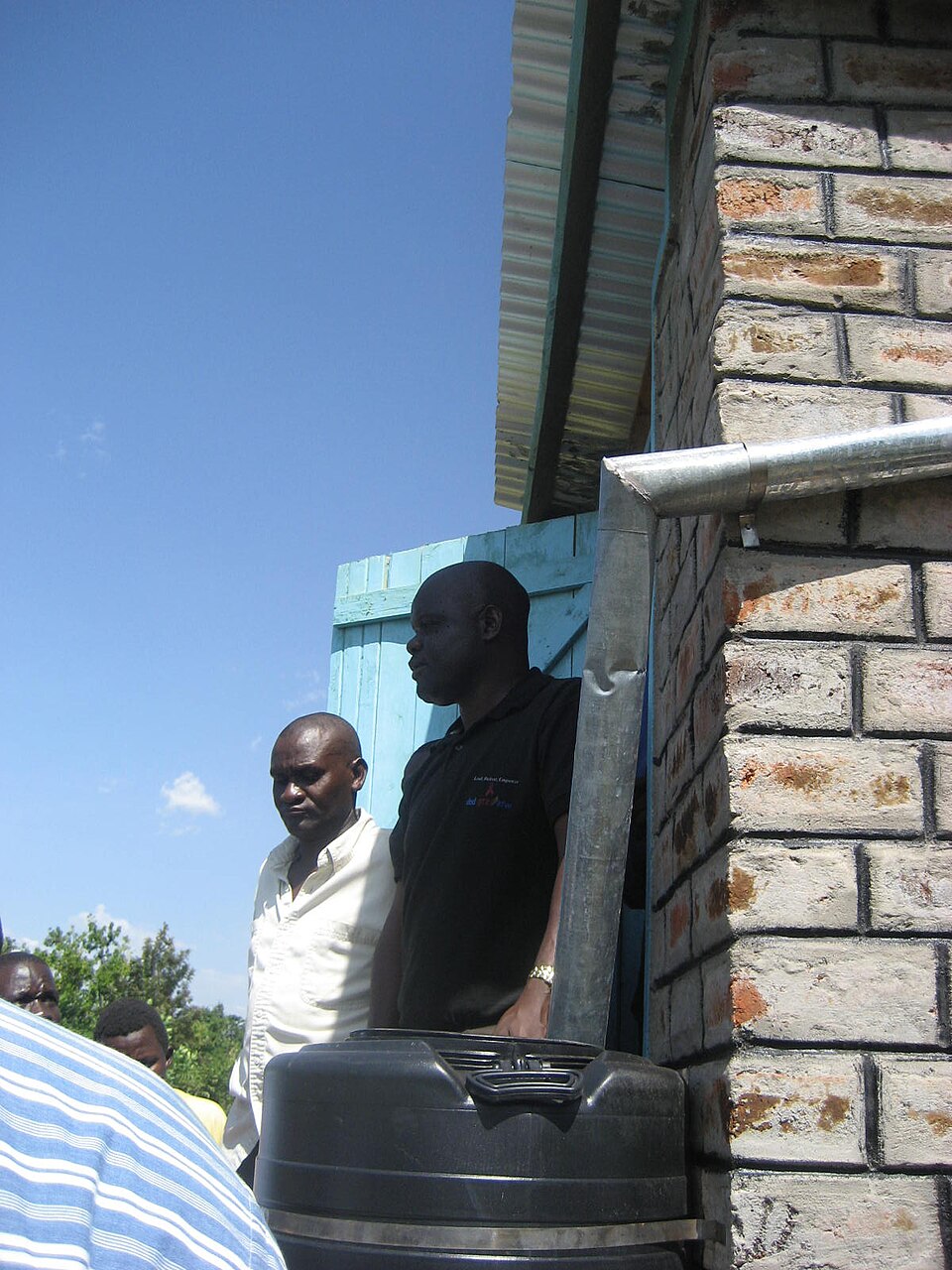 Roof gutter feeding rainwater storage tanks