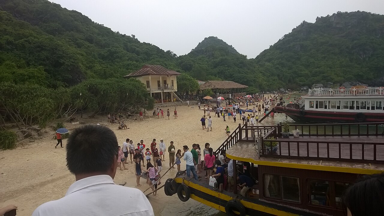 Passenger boats and travellers at Cat Ba in 2015